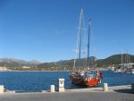 Red sailing boat in the port of Andratx Majorca