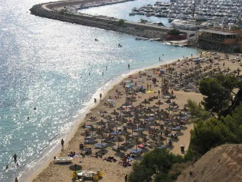 Puerto Portals view from the cliffs above showing beach and port