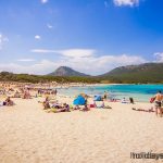 People sunbathing on Cala Ratjada beach