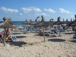 Parasols at Sa Coma beach Majorca