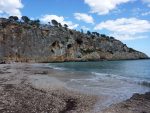 Pebble beach with steep cliffs at Cala Bota Majorca