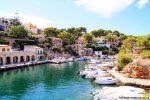 Boats in the natural harbour at Cala Figuera Majorca